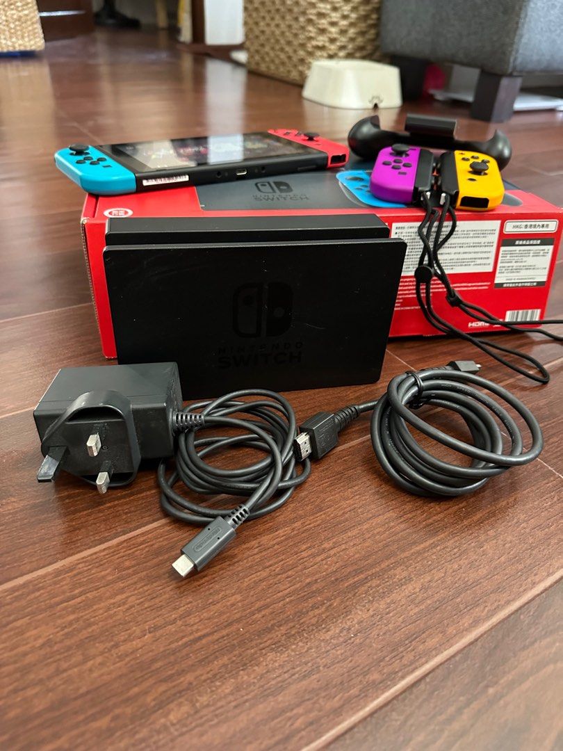 Switch v2 (Category: Nintendo) located in Calamba. Submitted by patcleansout (Listing ID 1247589491, Image 3). Description: Everything in the pictures are included Bought on Feb 2022 (Datablitz) RFS: barely used Nintendo Switch v2 unit + box 2 + 2 original Joycons with wrist straps Joycon hand grip Dock with original HDMI cable Charger Carrying bag Case (with signs of storage) Games included: Zumba, Wheel of Fortune/Jeopardy, Mario Party Supersta