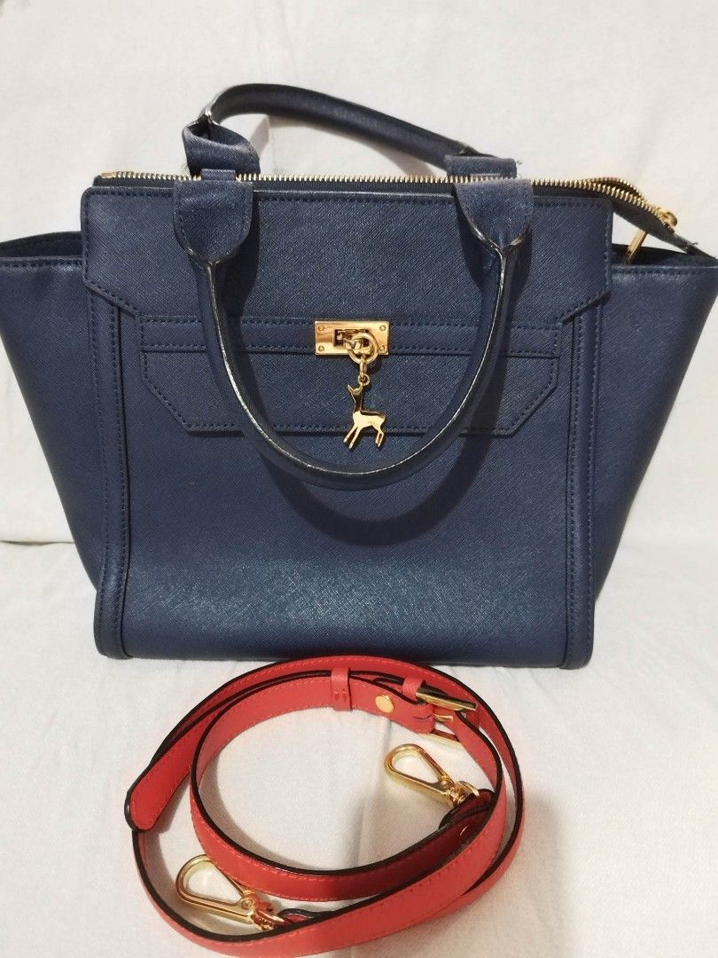BLACK by Martin Sitbon sling/handbag (Category: Luxury Bags & Wallets) located in Quezon City. Submitted by girlanne02 (Listing ID 1247834902, Image 1). Description: Black by Martin Sitbon office/casual bag navy blue in color sling strap red leather clean canvass inside sling bag hand bag no tarnish no sira in any part very good condition rfs: need extra cash.