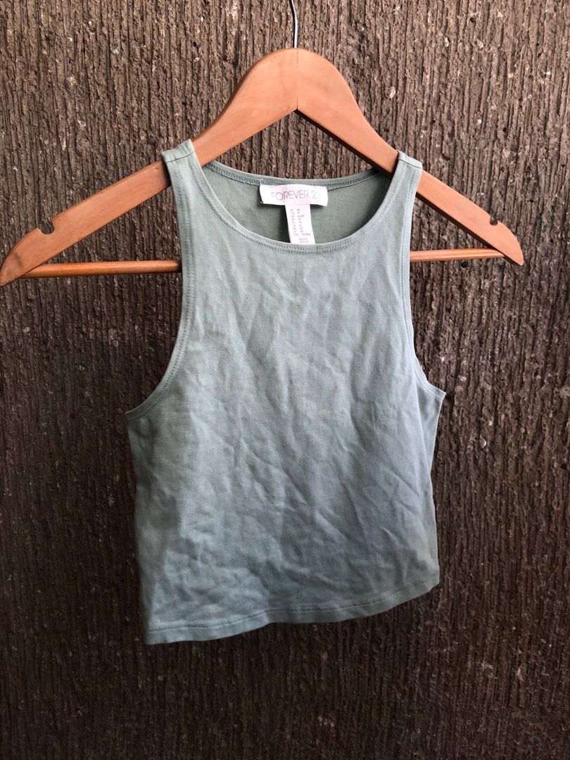 forever 21 sage green sleeveless top (Category: Sleeveless) located in Taguig. Submitted by unfeigned (Listing ID 1247862076, Image 2). Description: price is firm^^ has a very light discoloration in front (kindly refer to photos) .