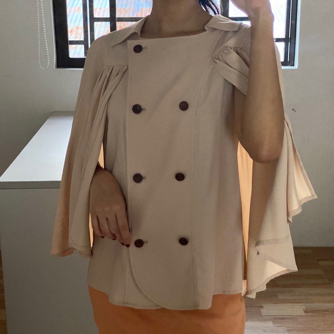 Lovely Royce Cape Sleeves Blouse (Category: Blouses) located in Rizal. Submitted by sann13 (Listing ID 1247840780, Image 1). Description: - For ₱500 only! - Size: S-M - Seller’s fave! premium quality and will keep if unable to sell - Perfect for: Smart casual, formal events, church attires, etc. - Issues: None - RFS: Decluttering - MOP: GCash only - Shipping: Lalamove or J&T.