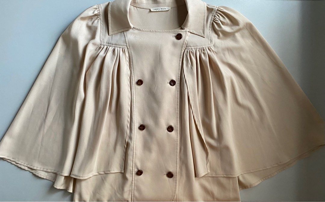 Lovely Royce Cape Sleeves Blouse (Category: Blouses) located in Rizal. Submitted by sann13 (Listing ID 1247840780, Image 3). Description: - For ₱500 only! - Size: S-M - Seller’s fave! premium quality and will keep if unable to sell - Perfect for: Smart casual, formal events, church attires, etc. - Issues: None - RFS: Decluttering - MOP: GCash only - Shipping: Lalamove or J&T.