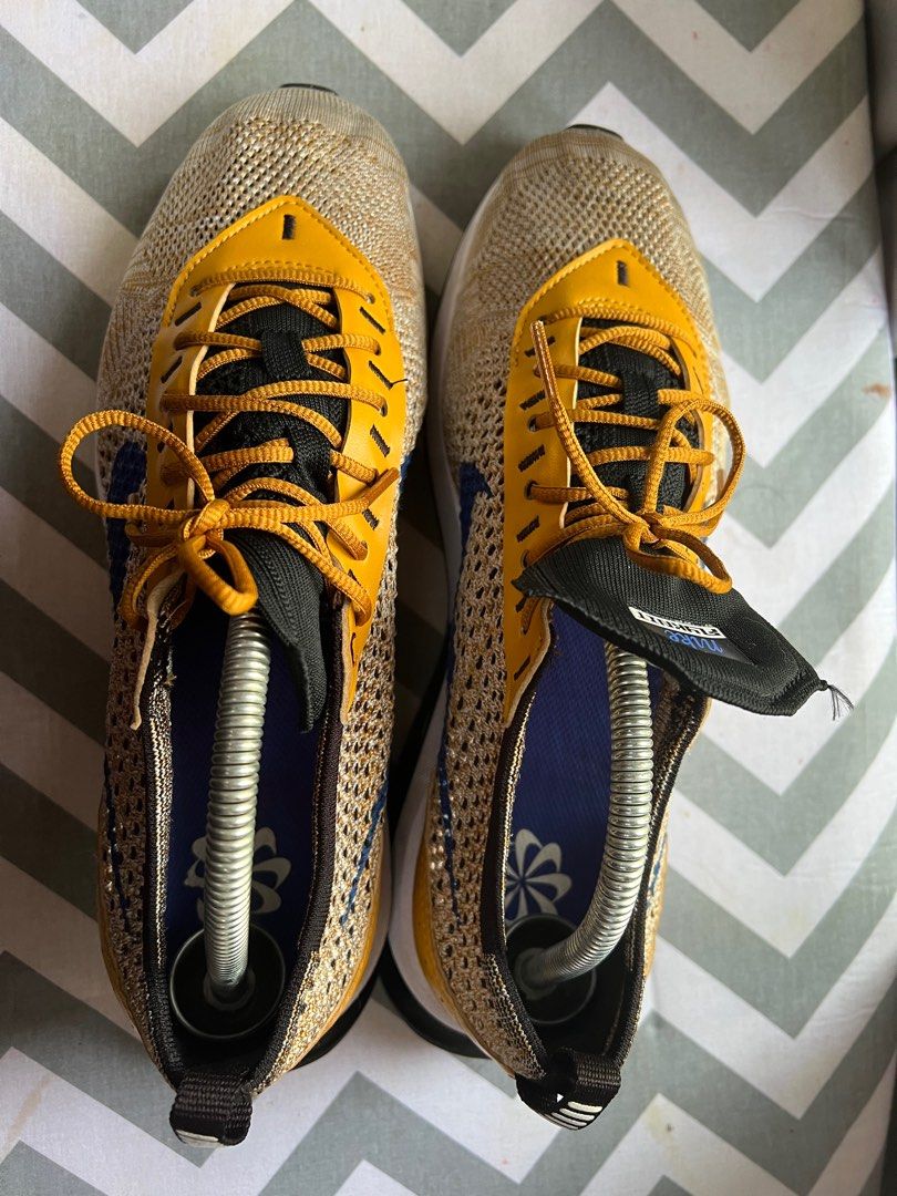 Nike flyknit racer mens gold best sale