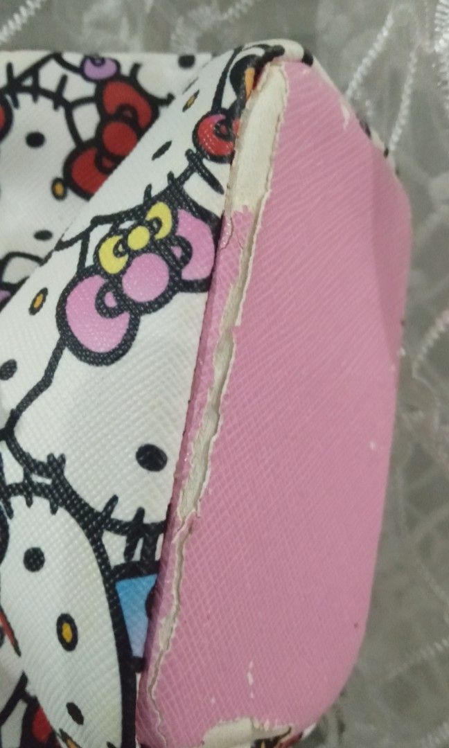 PRELOVED JAPAN Hello KittyxDearisimo mini drawstring leather pouch (Category: Purses & Pouches) located in Manila. Submitted by rinroo (Listing ID 1247885130, Image 3). Description: Authentic Hello Kitty Merchandise from Japan 2k+ orig price. can negotiate but pls be mindful selling as is with flaws (see pics above) leather fabric. detachable handle.drawstring. can fit earpods, lipstick, hair ties, alcohol bottle, small coin purse. pm me for more