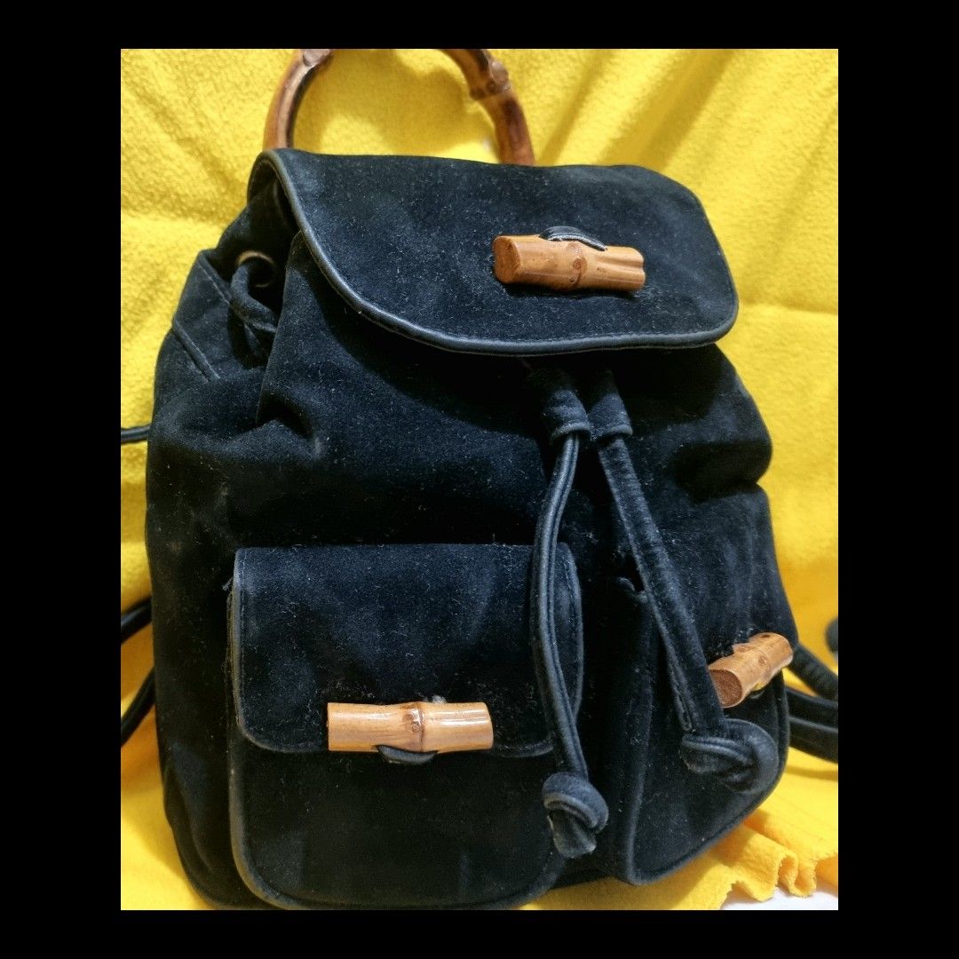 Bamboo Top Handle Mini Drawstring Backpack in Suede Leather (Category: Luxury Bags & Wallets) located in Rizal. Submitted by roccini (Listing ID 1247996322, Image 2). Description: Bamboo Top Handle Mini Backpack in Suede Leather -Mini Backpack -With Two Front Pockets in Velcro Closure with Bamboo Designs -Main Compartment is in Drawstring Closure. On the other side, it has zip closure if they do not intend to open the drawstring -Black Suede Leat