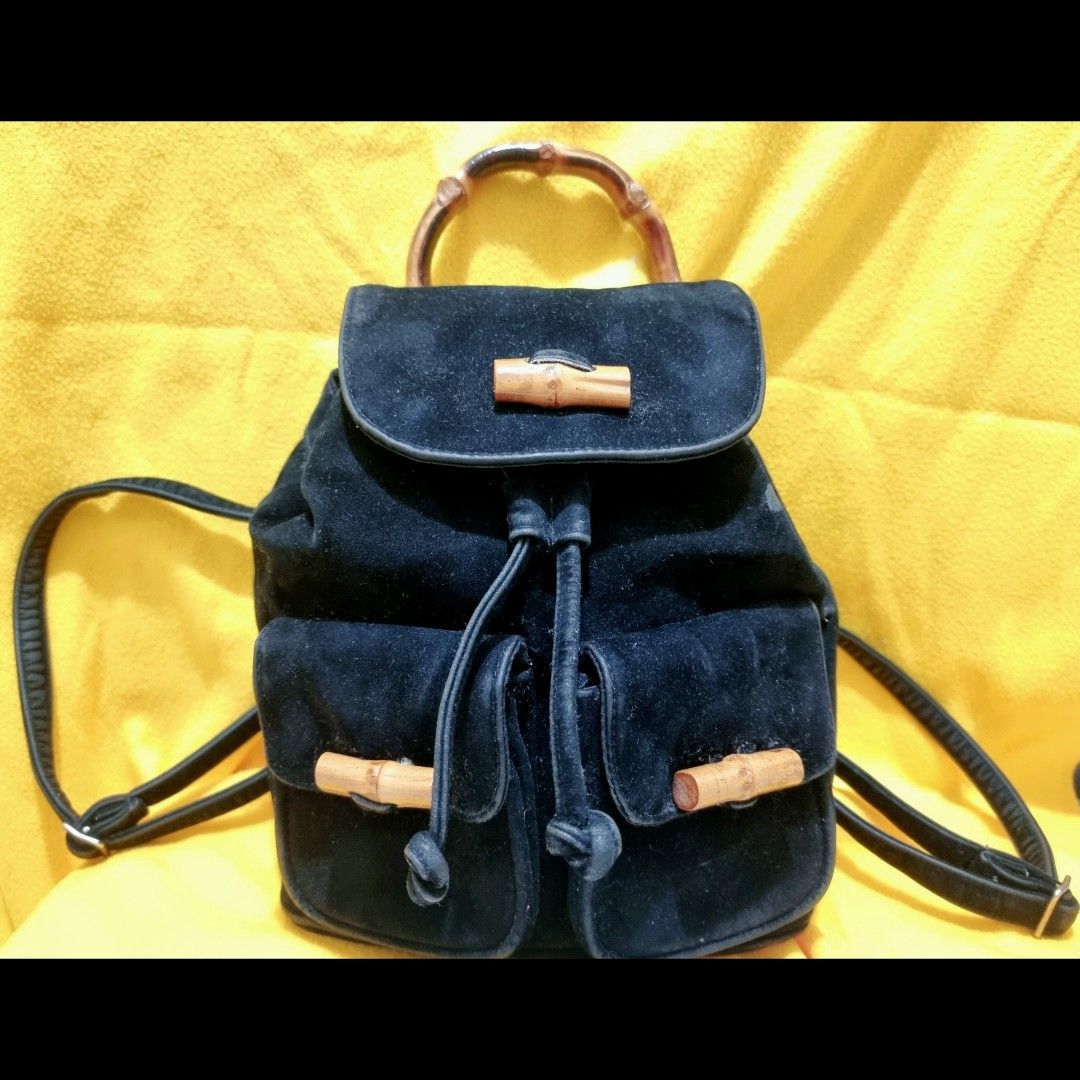 Bamboo Top Handle Mini Drawstring Backpack in Suede Leather (Category: Luxury Bags & Wallets) located in Rizal. Submitted by roccini (Listing ID 1247996322, Image 1). Description: Bamboo Top Handle Mini Backpack in Suede Leather -Mini Backpack -With Two Front Pockets in Velcro Closure with Bamboo Designs -Main Compartment is in Drawstring Closure. On the other side, it has zip closure if they do not intend to open the drawstring -Black Suede Leat