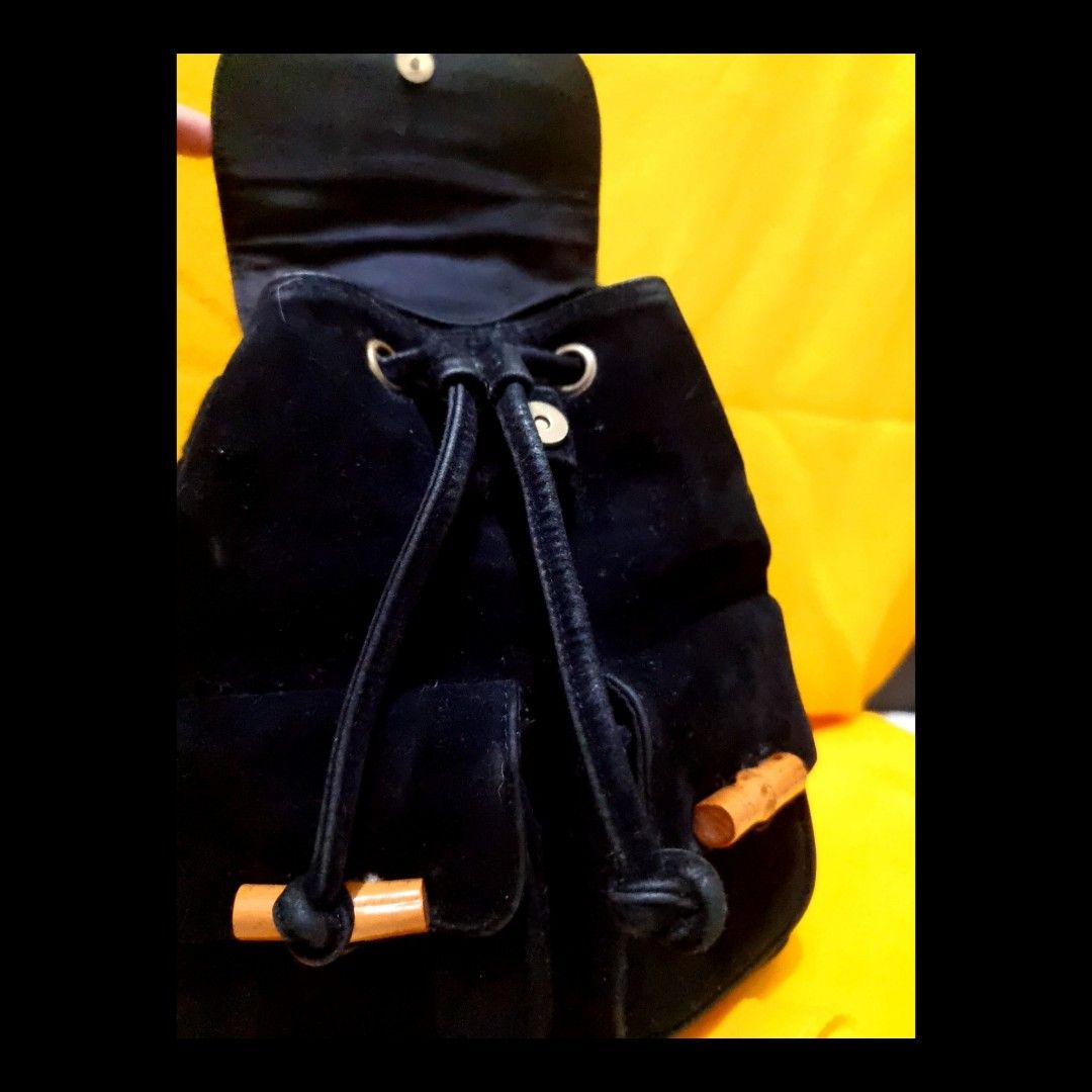 Bamboo Top Handle Mini Drawstring Backpack in Suede Leather (Category: Luxury Bags & Wallets) located in Rizal. Submitted by roccini (Listing ID 1247996322, Image 3). Description: Bamboo Top Handle Mini Backpack in Suede Leather -Mini Backpack -With Two Front Pockets in Velcro Closure with Bamboo Designs -Main Compartment is in Drawstring Closure. On the other side, it has zip closure if they do not intend to open the drawstring -Black Suede Leat