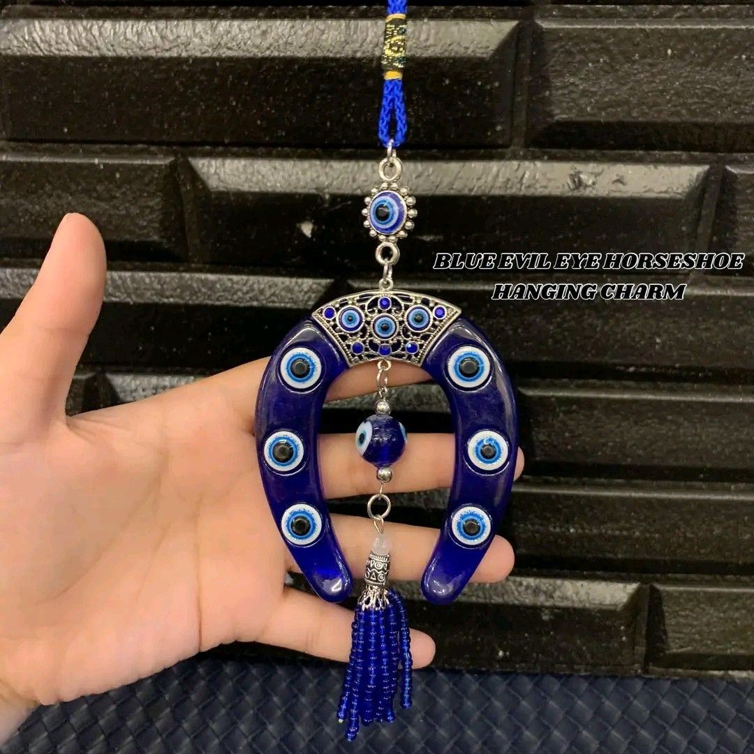 Blue evil eye horseshoe hanging charm (Category: Other Home Decor) located in Manila. Submitted by delynonlineshopping_ (Listing ID 1248009450, Image 3). Description: 🧿 BLUE EVIL EYE HORSESHOE HANGING CHARM 🧿 🧿 EVIL EYE = PANG TABOY ITO NG MALAS , INGGIT , POOT , GALIT AT SAKIT .. 🧿 EVIL EYE - The Evil Eye is a very powerful, traditional protective symbol used in Feng Shui against harmful energy. It can be used for personal protection, for ba