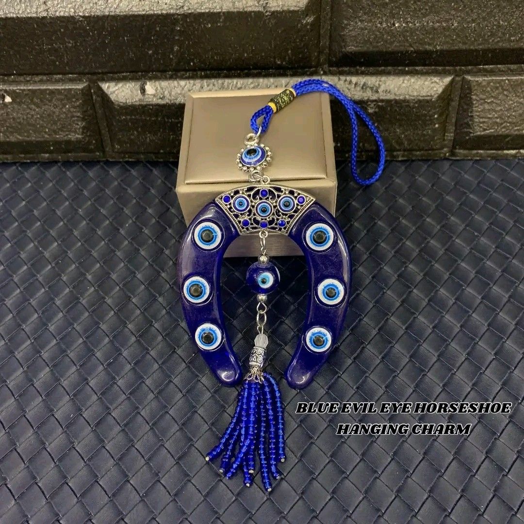 Blue evil eye horseshoe hanging charm (Category: Other Home Decor) located in Manila. Submitted by delynonlineshopping_ (Listing ID 1248009450, Image 1). Description: 🧿 BLUE EVIL EYE HORSESHOE HANGING CHARM 🧿 🧿 EVIL EYE = PANG TABOY ITO NG MALAS , INGGIT , POOT , GALIT AT SAKIT .. 🧿 EVIL EYE - The Evil Eye is a very powerful, traditional protective symbol used in Feng Shui against harmful energy. It can be used for personal protection, for ba
