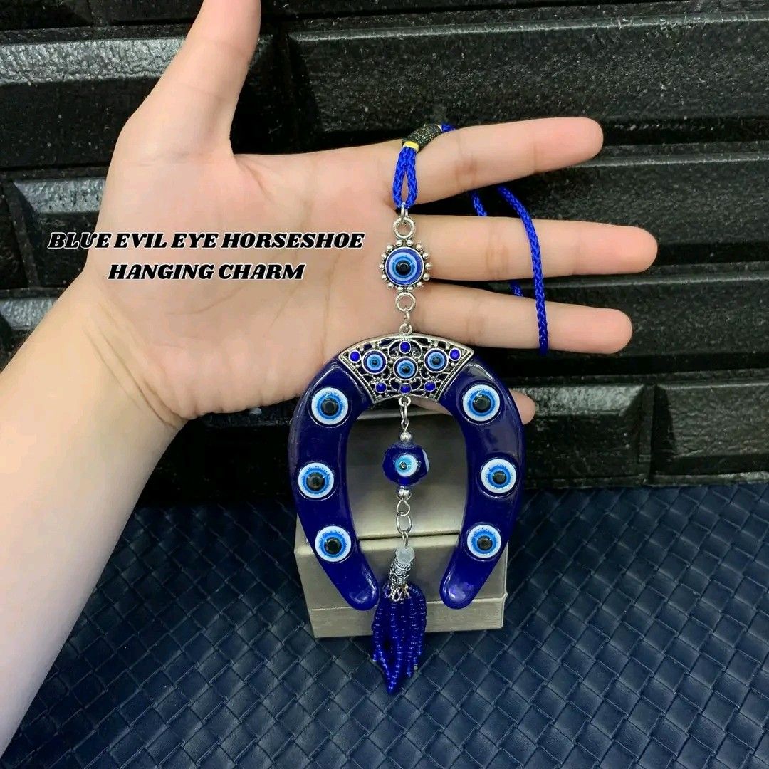 Blue evil eye horseshoe hanging charm (Category: Other Home Decor) located in Manila. Submitted by delynonlineshopping_ (Listing ID 1248009450, Image 2). Description: 🧿 BLUE EVIL EYE HORSESHOE HANGING CHARM 🧿 🧿 EVIL EYE = PANG TABOY ITO NG MALAS , INGGIT , POOT , GALIT AT SAKIT .. 🧿 EVIL EYE - The Evil Eye is a very powerful, traditional protective symbol used in Feng Shui against harmful energy. It can be used for personal protection, for ba
