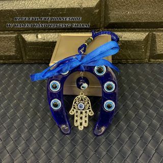 Blue evil eye horseshoe with hamsa hand hanging charm