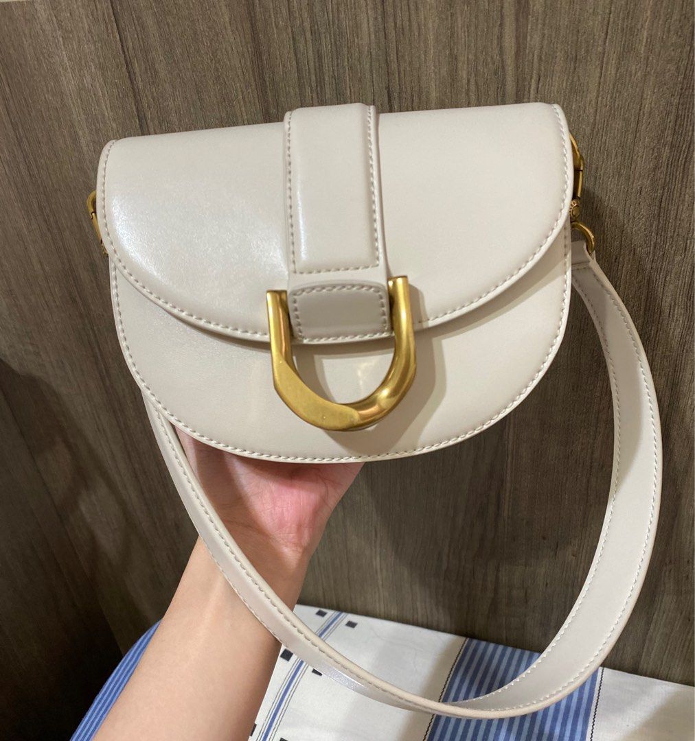 Charles & Keith Gabine Saddle Bag (M), Women's Fashion, Bags & Wallets,  Shoulder Bags on Carousell