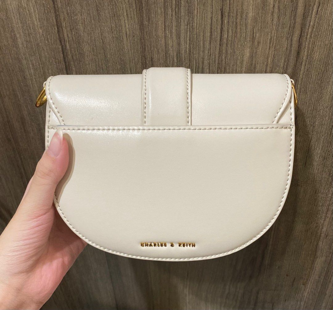 Charles & Keith Mini Gabine Saddle Bag Cream, Women's Fashion, Bags