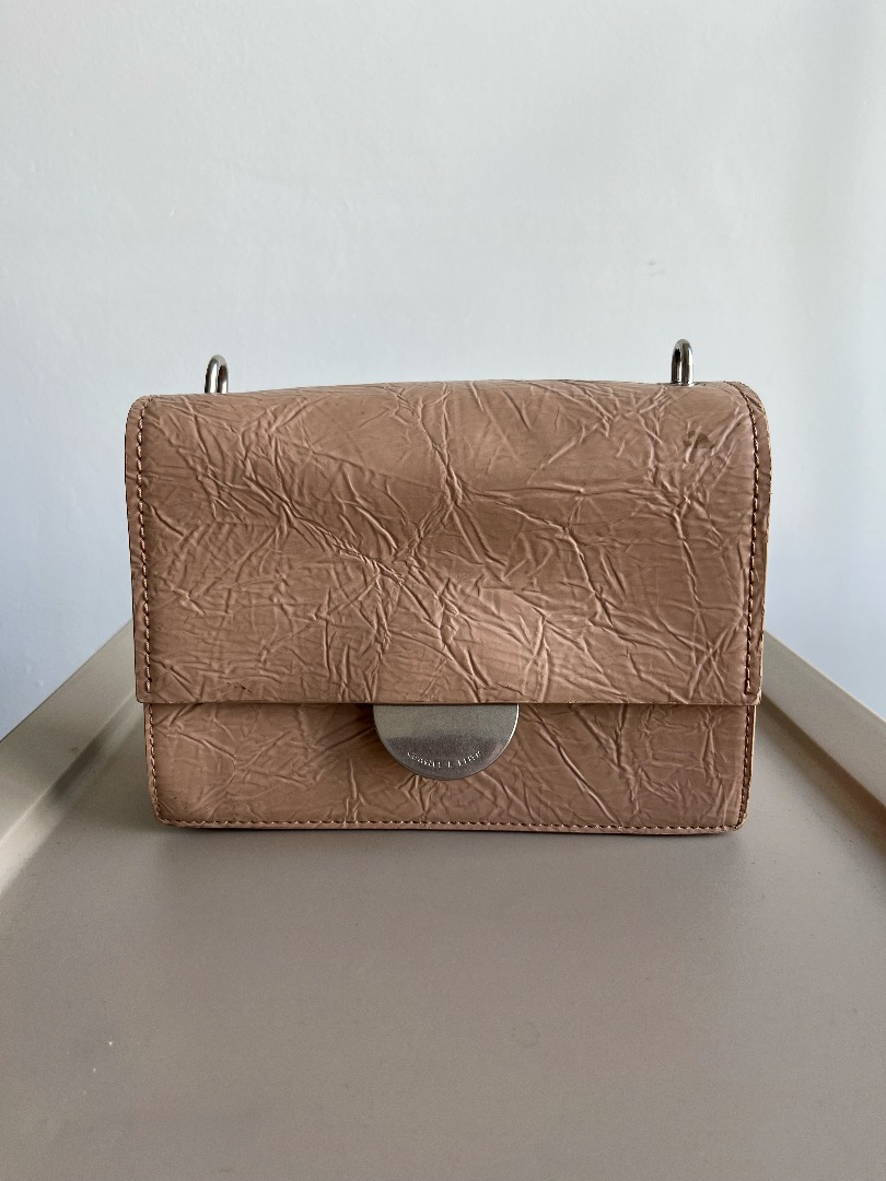 Round metal accent wrinkled effect bag online