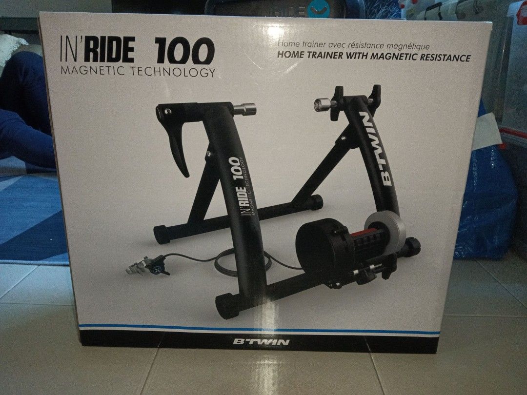 Home trainer with magnetic resistance