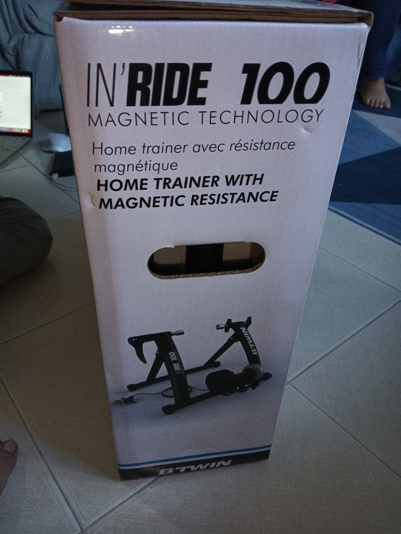 Home trainer with magnetic resistance