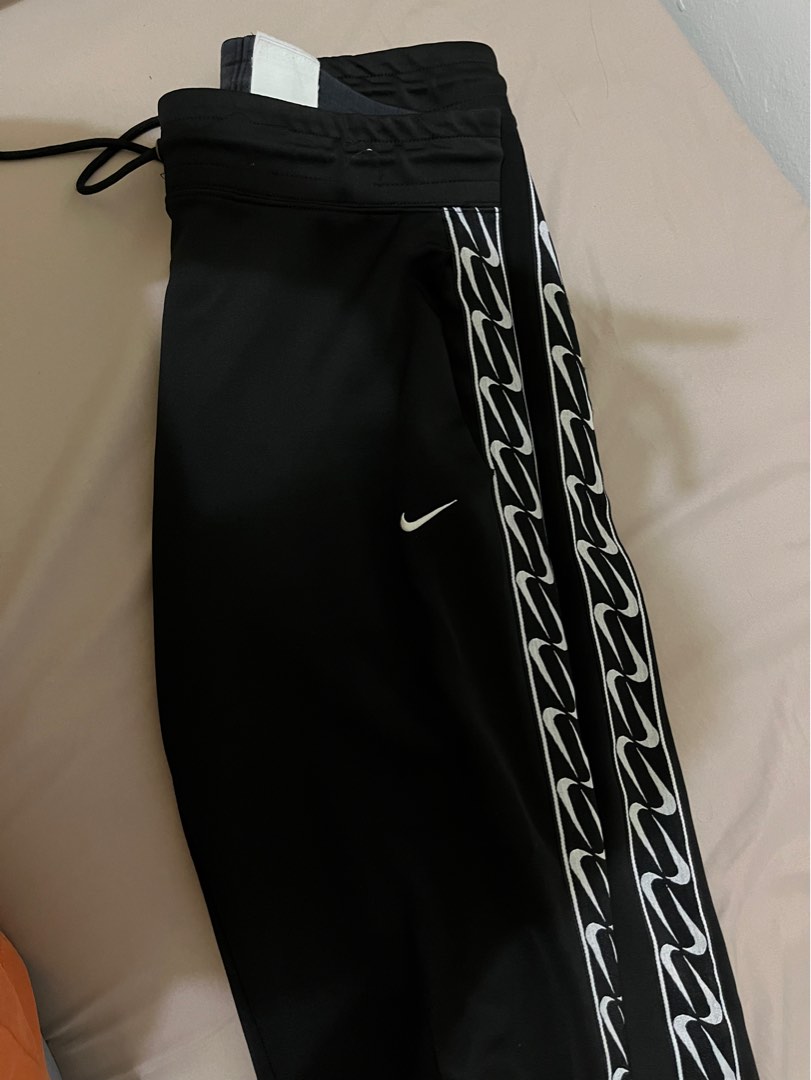 Nike swoosh hotsell tape joggers
