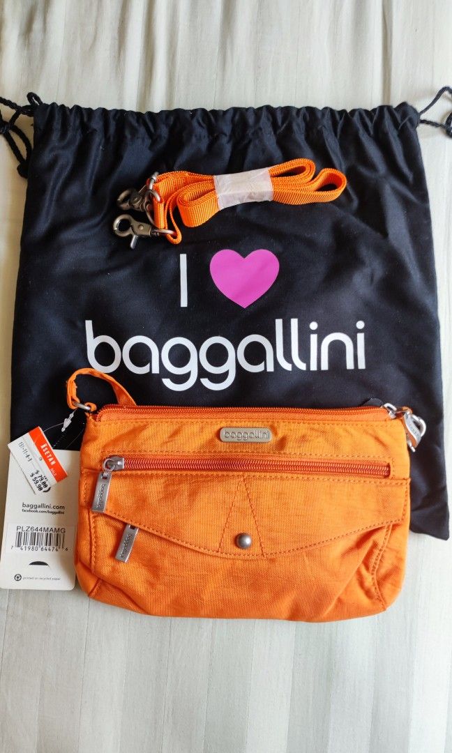 Orange Baggallini clutch with removable sling bag strap Women s