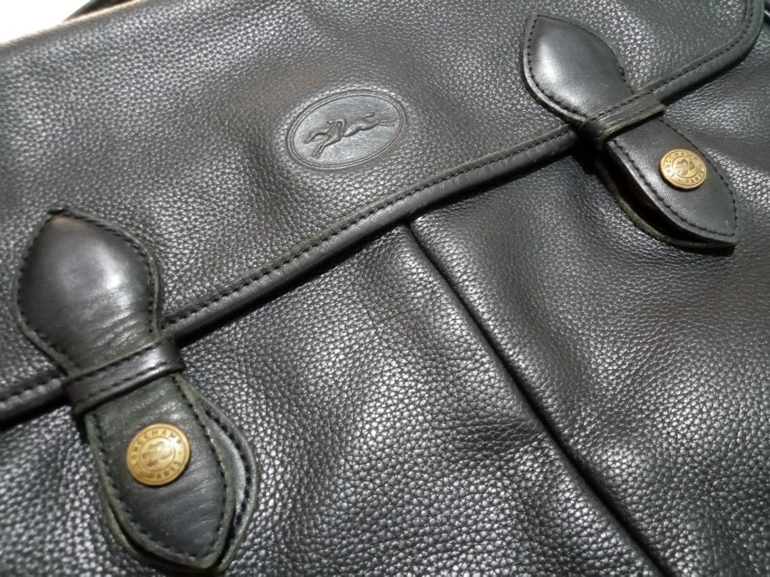 Vintage Longchamp Document Bag (Category: Briefcases) located in Cebu City. Submitted by maksipreloveditems (Listing ID 1247913304, Image 3). Description: Vintage Longchamp Document Bag Color: Midnight Blue * Item is in Cebu City. PLEASE READ: Photos posted are FINAL. NO "When Worn Photos" request please. Flaws were mentioned in the description and shown in the pictures posted. Dimensions: Shoulder: Arms: Length: 13.75 inches Width: 2 inches Heig