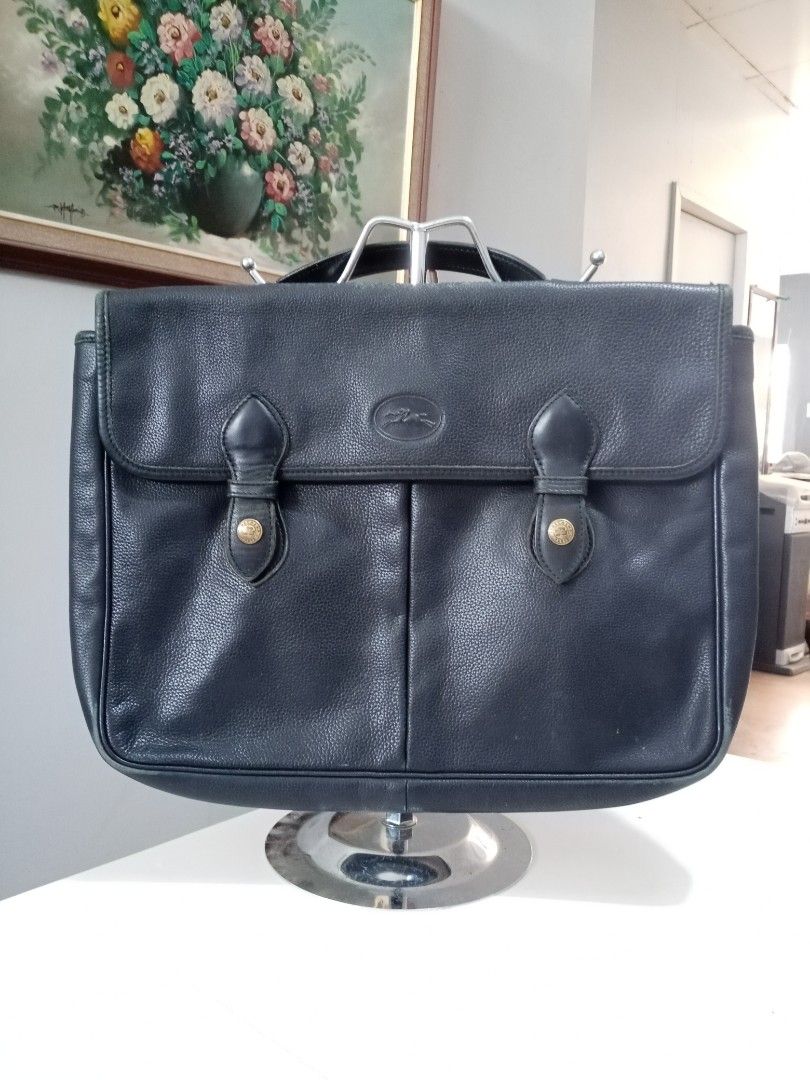 Vintage Longchamp Document Bag (Category: Briefcases) located in Cebu City. Submitted by maksipreloveditems (Listing ID 1247913304, Image 1). Description: Vintage Longchamp Document Bag Color: Midnight Blue * Item is in Cebu City. PLEASE READ: Photos posted are FINAL. NO "When Worn Photos" request please. Flaws were mentioned in the description and shown in the pictures posted. Dimensions: Shoulder: Arms: Length: 13.75 inches Width: 2 inches Heig