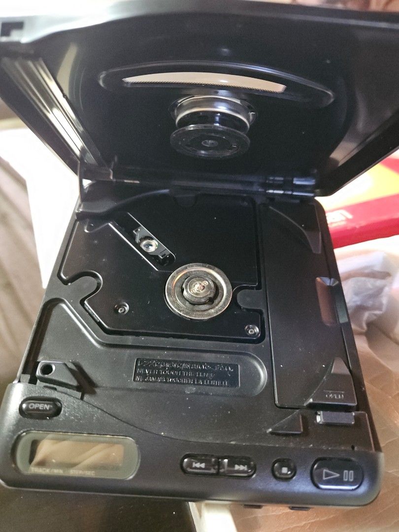 Vintage Sony Discman D-11 Compact CD Player (Category: Portable Music Players) located in Manila. Submitted by dreamcart (Listing ID 1247955202, Image 2). Description: Sony Discman D-11 Full inclusions. Has box, manual (in Japanese and English), cord, and the discman itself. Used by my mother in the 90s. Found it in the house. No idea if its working or not. It has battery compartments (4 AA batteries) and 9 volts charger (?). Item looks good in a