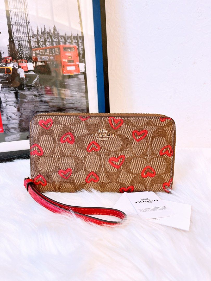 Coach large phone wallet in signature canvas online