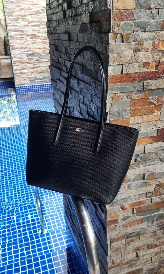 Lacoste Chantaco Leather Black Tote Bag (Category: Luxury Bags & Wallets) located in Makati City. Submitted by lilyignacio81 (Listing ID 1252376599, Image 2). Description: Personal Collection Bought here in Makati Original. The Lacoste Chantaco Leather Black Tote Bag – a perfect fusion of sporty elegance and practicality, reflecting the Lacoste brand's commitment to quality craftsmanship and timeless design. Allow me to guide you through the allu
