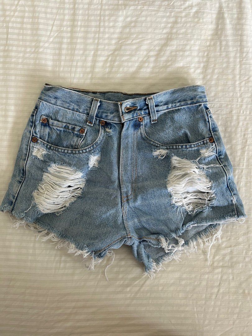 Ripped levis shorts hot sale