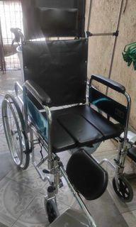 Reclining wheelchair with commode