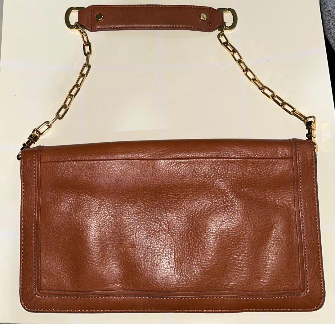 Tory Burch Clutch with Gold Chain (Category: Luxury Bags & Wallets) located in Taguig. Submitted by claudiax (Listing ID 1252200709, Image 2). Description: .