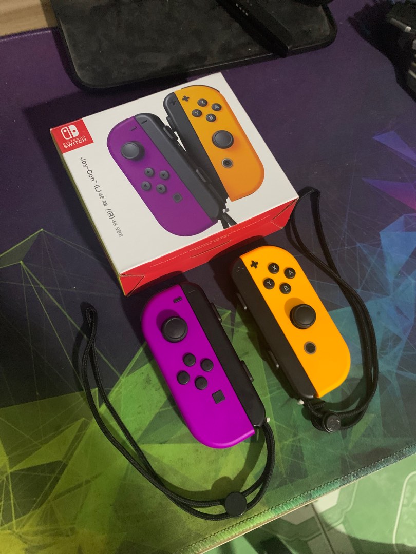 Nintendo Switch Joy Con Controller, Neon Purple/ Orange