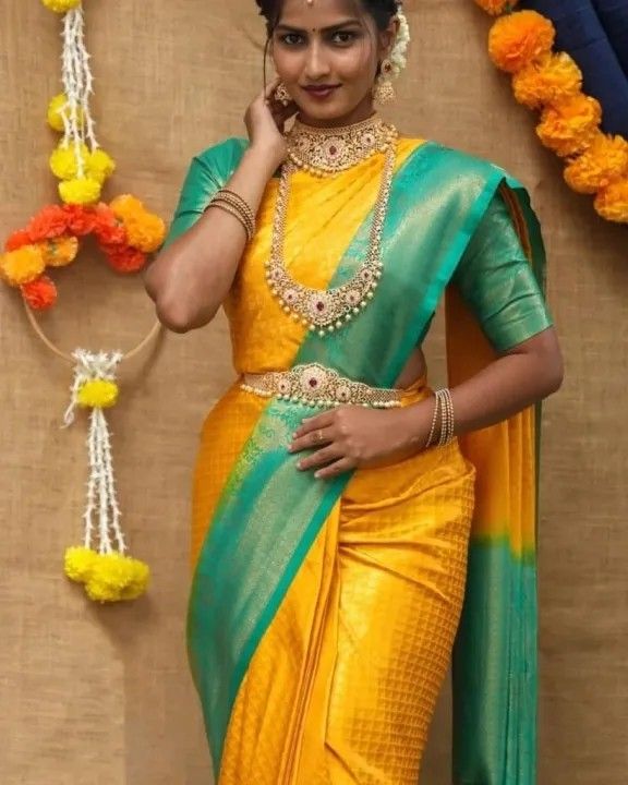 Yellow embossed vasundhara silk mix saree, contrast zari border & pallu of  intricate patterns