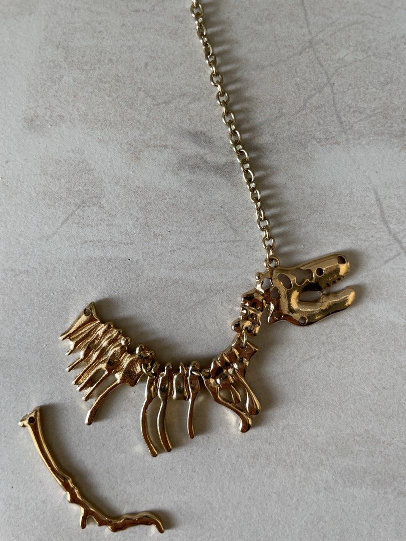 Gold hotsell dinosaur necklace