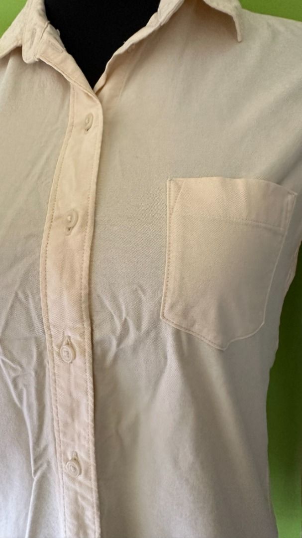 UNIQLO Linen Long Sleeves (Category: Longsleeves) located in Quezon City. Submitted by ccsonceloveditems (Listing ID 1253973737, Image 2). Description: UNIQLO Linen Long Sleeves Light yellow color with spare buttons MOP: Gcash BPI.