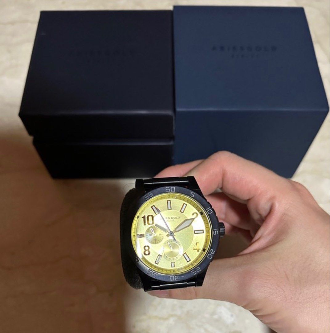 Gold dial black strap sale watch