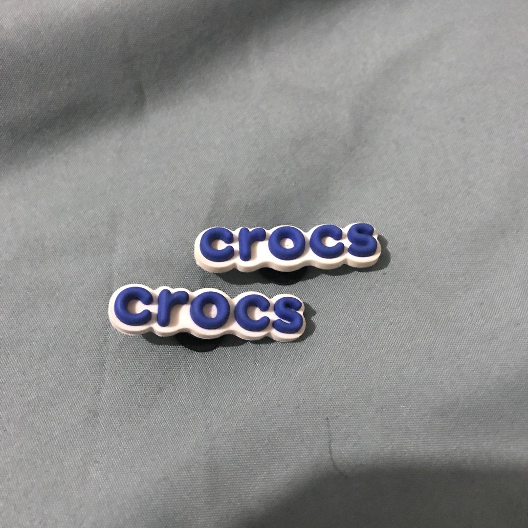 Jibbitz Crocs Logo, Fesyen Wanita, Aksesoris di Carousell