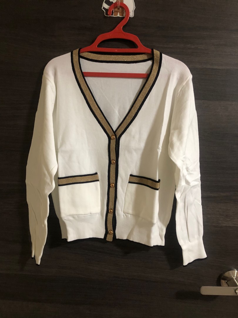White cardigan with cheap red trim