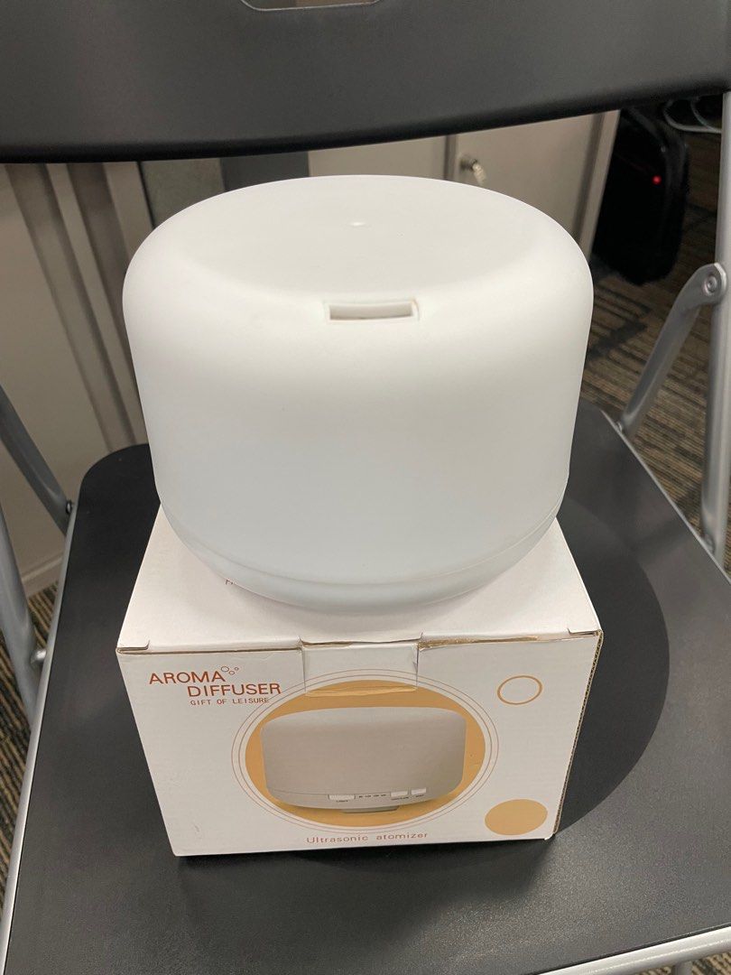 Aroma Diffuser (Category: Air Purifiers & Dehumidifiers) located in Singapore. Submitted by no.name123 (Listing ID 1254334366, Image 1). Description: Aroma Diffuser with changing light plus remote control. Con dition 10/10. Selling cos not using it. .