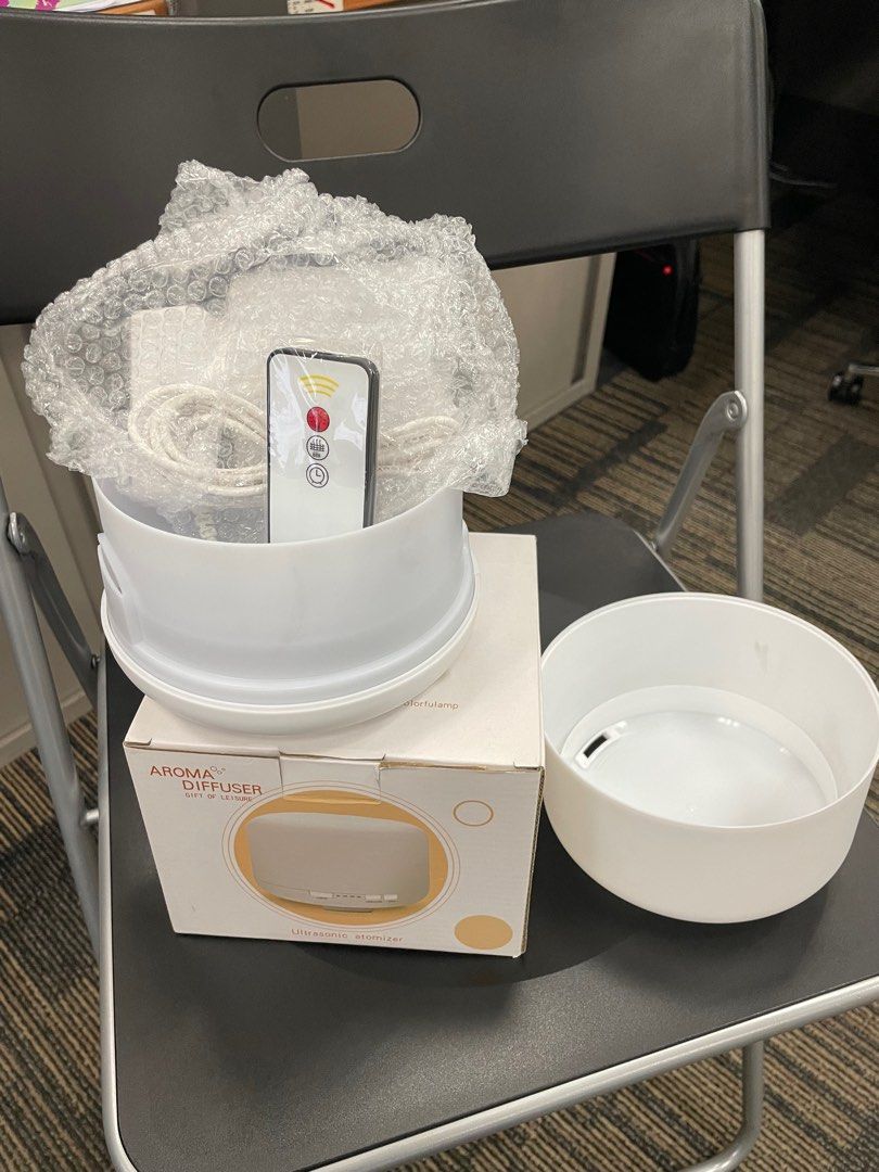 Aroma Diffuser (Category: Air Purifiers & Dehumidifiers) located in Singapore. Submitted by no.name123 (Listing ID 1254334366, Image 2). Description: Aroma Diffuser with changing light plus remote control. Con dition 10/10. Selling cos not using it. .