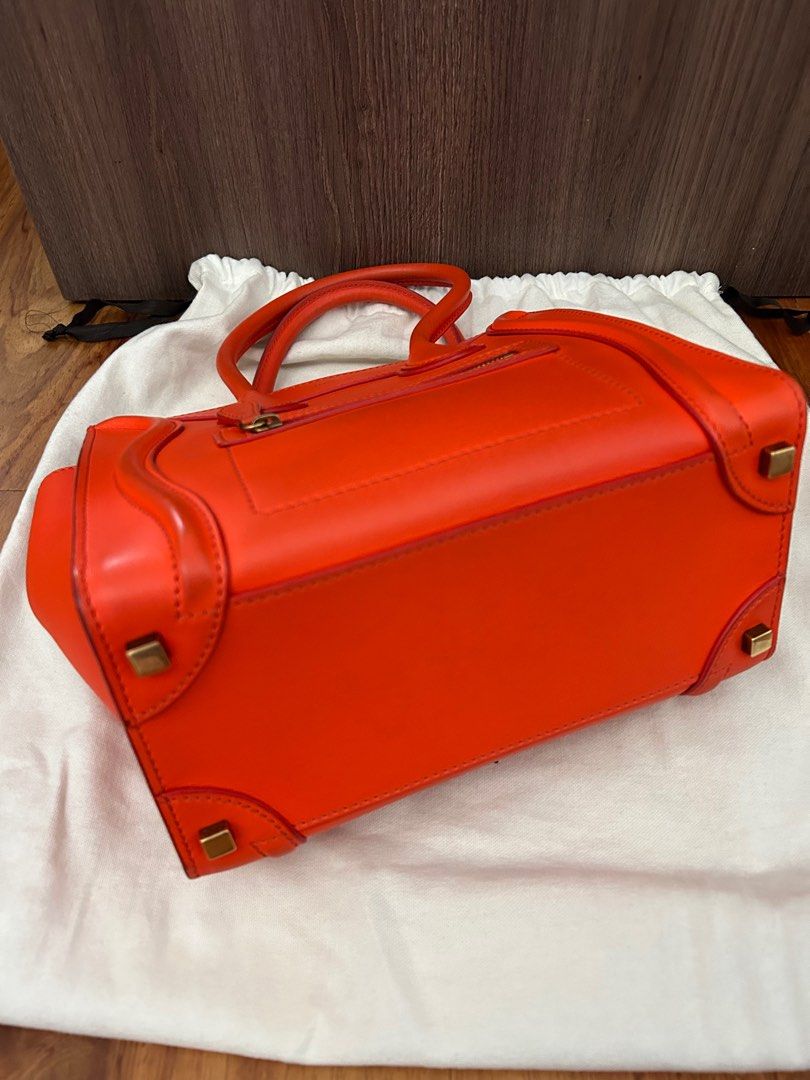 Authentic Celine Micro Bag (Category: Luxury Bags & Wallets) located in Paranaque City. Submitted by luxury_finds (Listing ID 1254282520, Image 3). Description: this is bright orange celine micro bag, still in good condition with minor dirt only, complete with receipt, bought in Hongkong 2017, msg me if you want to see more pictures .