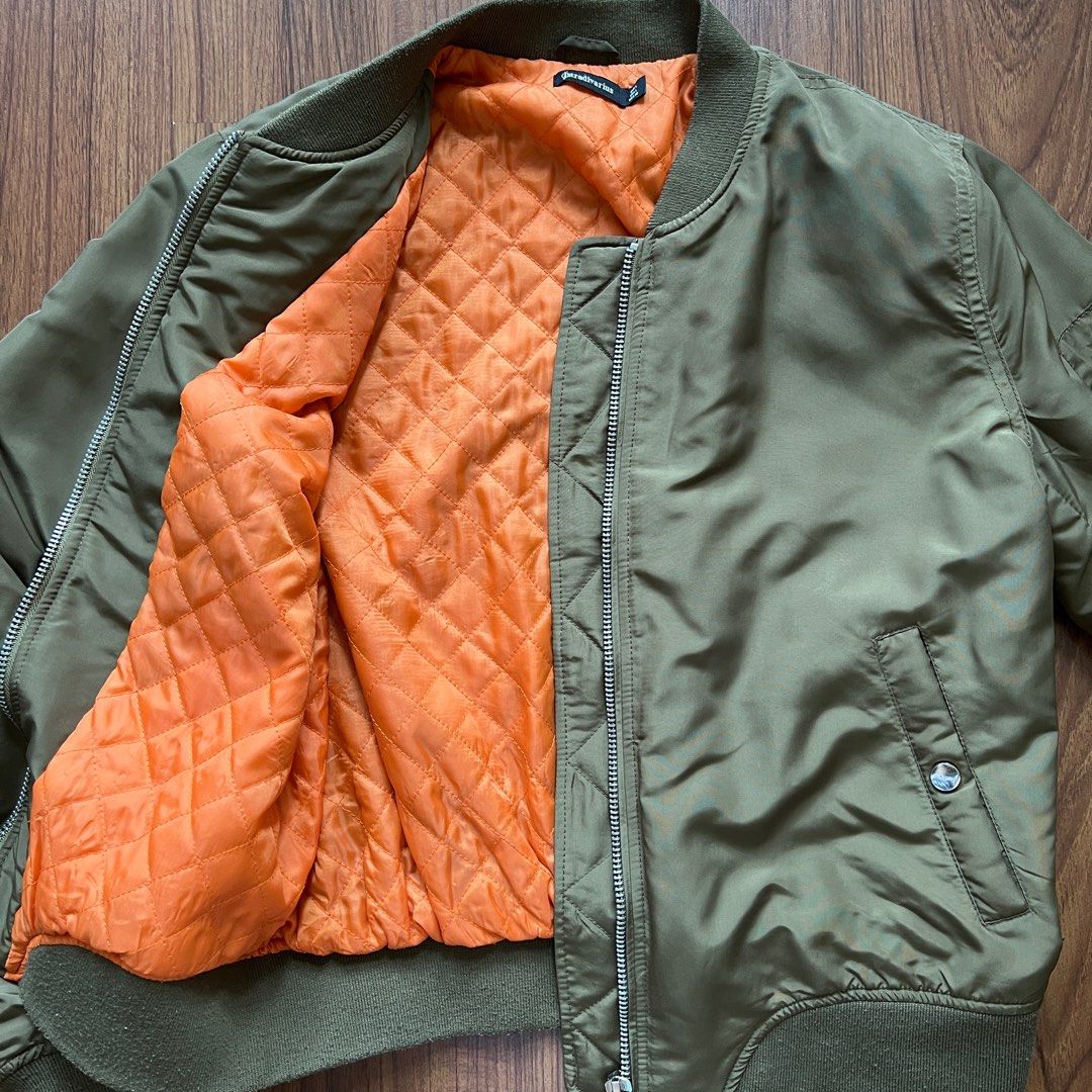Green bomber jacket with orange inside sales