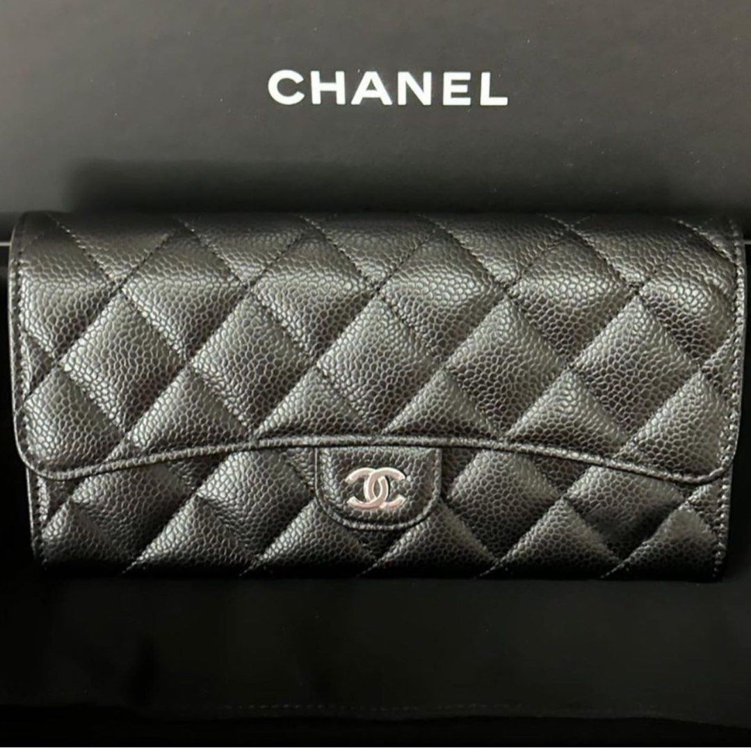 100% authentic Pre-Owned Chanel L-Flap wallet. Black leather.