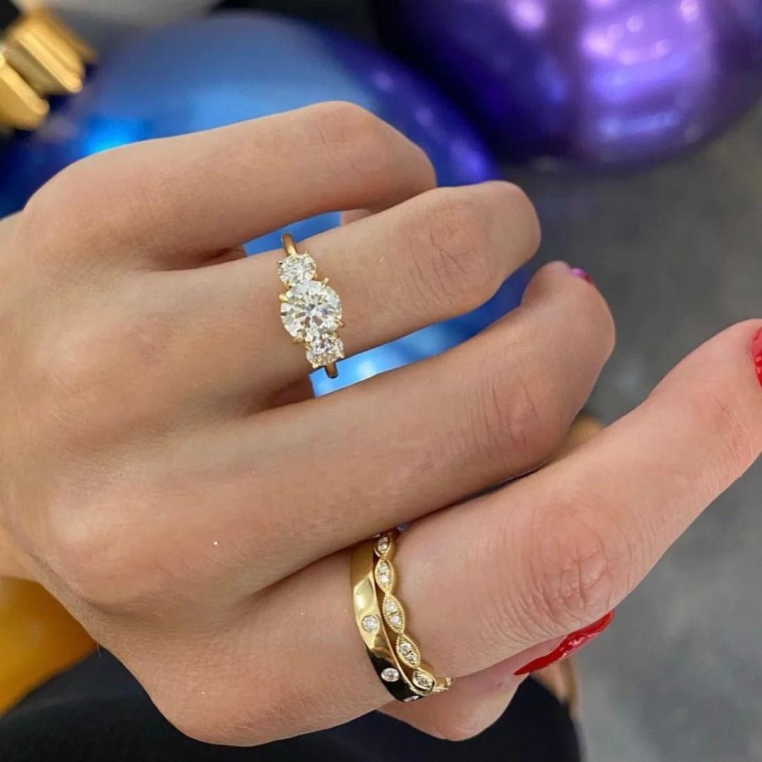 Gold trilogy hot sale engagement ring