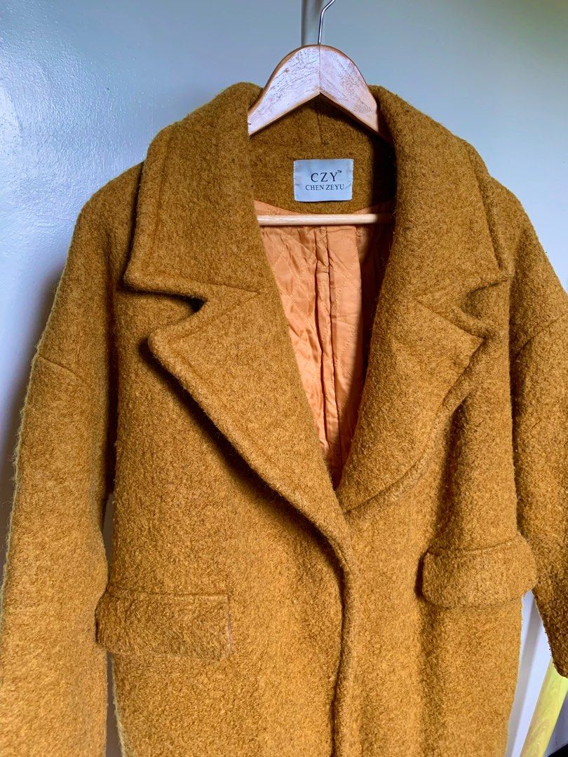 Mustard Yellow Winter Wool Coat (Category: Coats, Jackets and Outerwear) located in Caloocan City. Submitted by hellodeco (Listing ID 1254680145, Image 2). Description: Mustard Yellow Winter Wool Coat Love this color so much! Heavy coat Size: S - XL Flaws: may onting himulmol but unnoticeable naman. Can also be removed. First button, easily unbuttoned. RFS. Decluttering. Needs space for the new ones..
