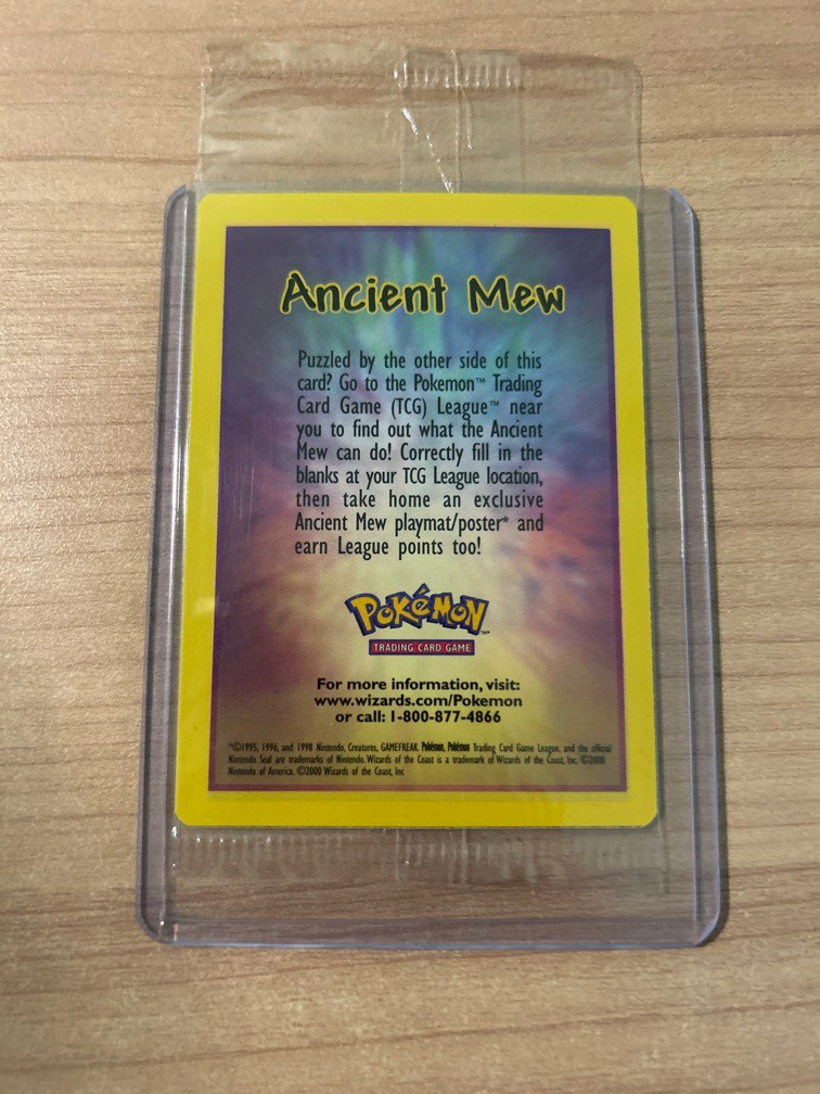 A rare Ancient Mew Pokémon card in perfect condition, typo and all