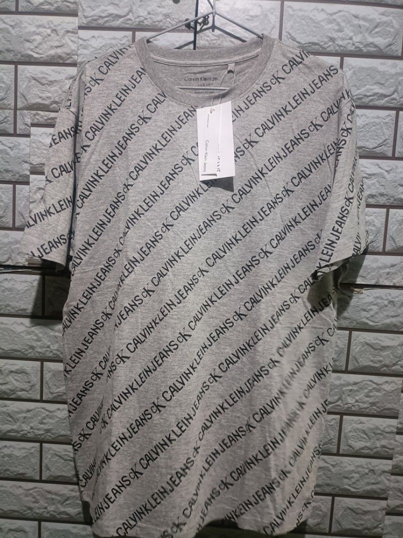 Calvin Klein shirt, Men's Fashion, Tops & Sets, Tshirts & Polo Shirts on  Carousell