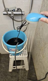 Confinement shower pump for herbal bath
