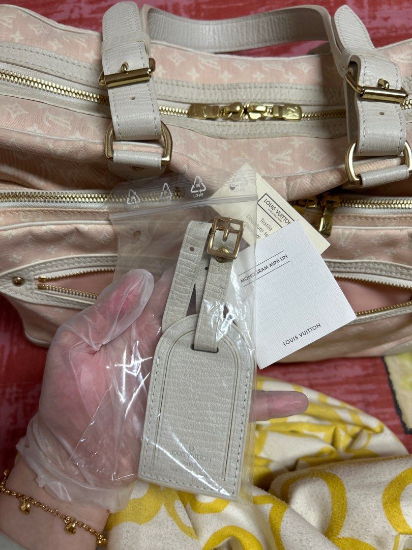 Louis Vuitton mini Lin diaper bag in pink