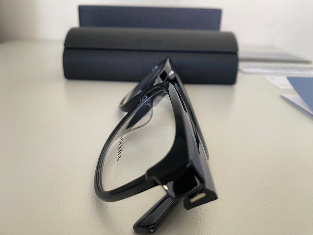 Prada glasses / spectacles / frames (Category: Sunglasses & Eyewear) located in Singapore. Submitted by come2mama (Listing ID 1254897129, Image 5). Description: Brand new Prada classic italian look (size 55) Selling because i bought it thinking i have lost my old spectacles, but found it shortly after Purchased for $380.