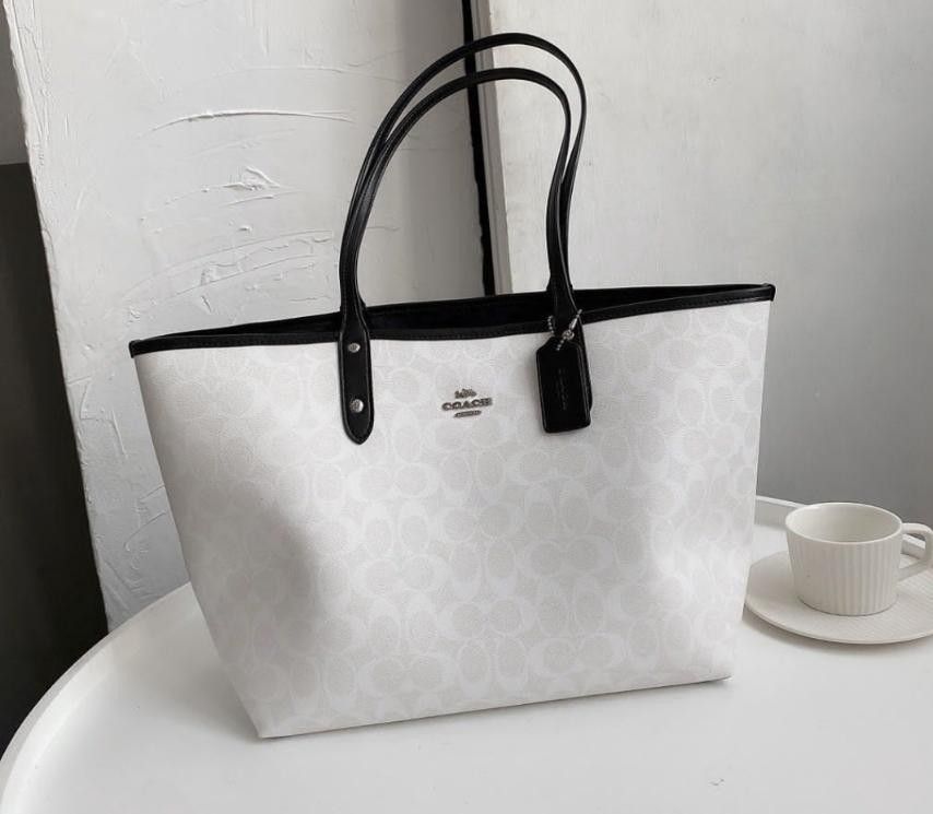 Coach reversible tote best sale black and white