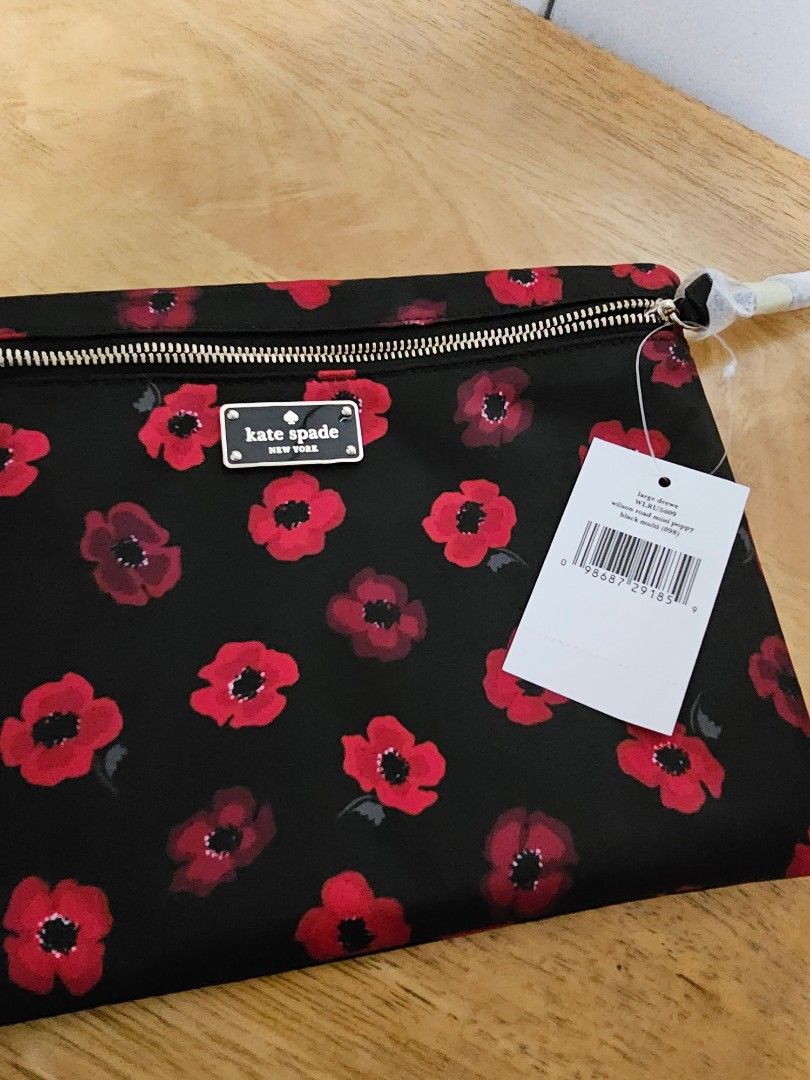 Repriced! Kate Spade Clutch (Category: Clutches) located in Pasig City. Submitted by rokels_locker (Listing ID 272413506, Image 3). Description: -Kate Spade New York Wilson Road Large Drewe Clutch - front zipper closure -Embossed black/gold toned brand name logo in front -Approx. dimensions: 10 in (L) x 7.25 in (H) x 0.5 in (W).